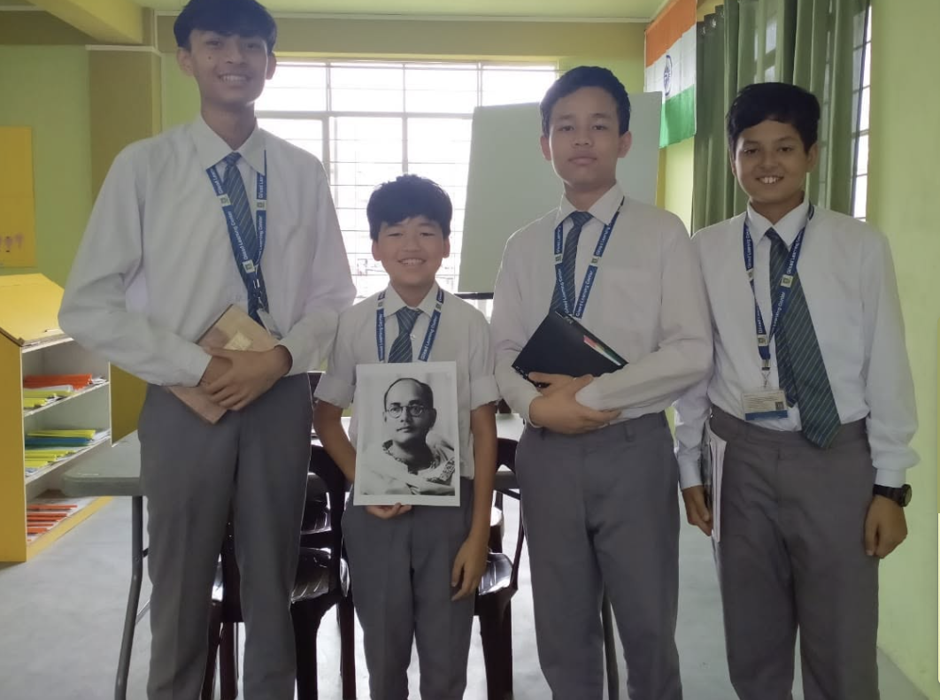 Four GLC Shillong students standing together in their school uniforms