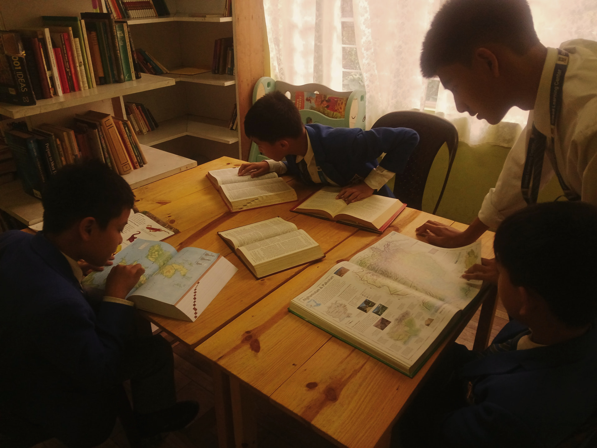 GLC Shillong students studying around books